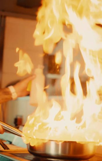 Flames rising from the pan during service